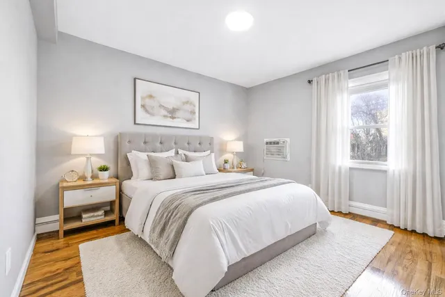 a bedroom with bed and a window