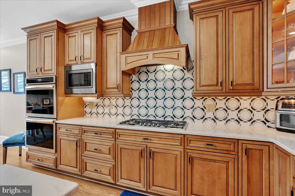 341 Station Avenue Haddonfield, NJ 08033 - Photo 18 of 71 a kitchen with stainless steel appliances granite countertop a refrigerator and cabinets