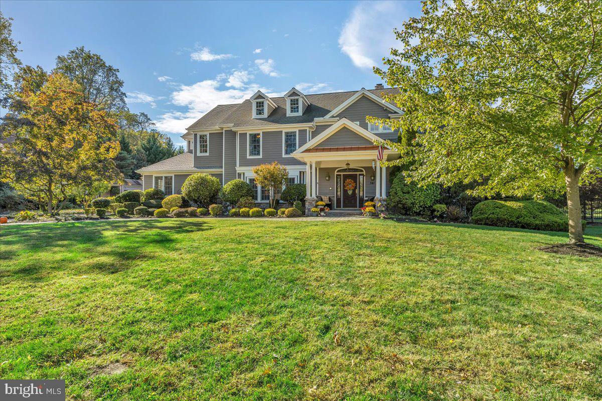 341 Station Avenue Haddonfield, NJ 08033 - Photo 2 of 71 a front view of a house with a yard