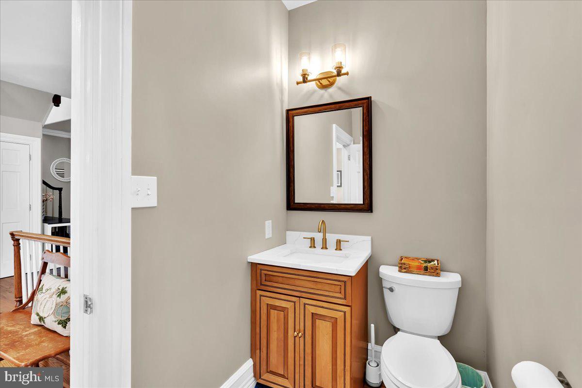 341 Station Avenue Haddonfield, NJ 08033 - Photo 26 of 71 a bathroom with a toilet sink and mirror