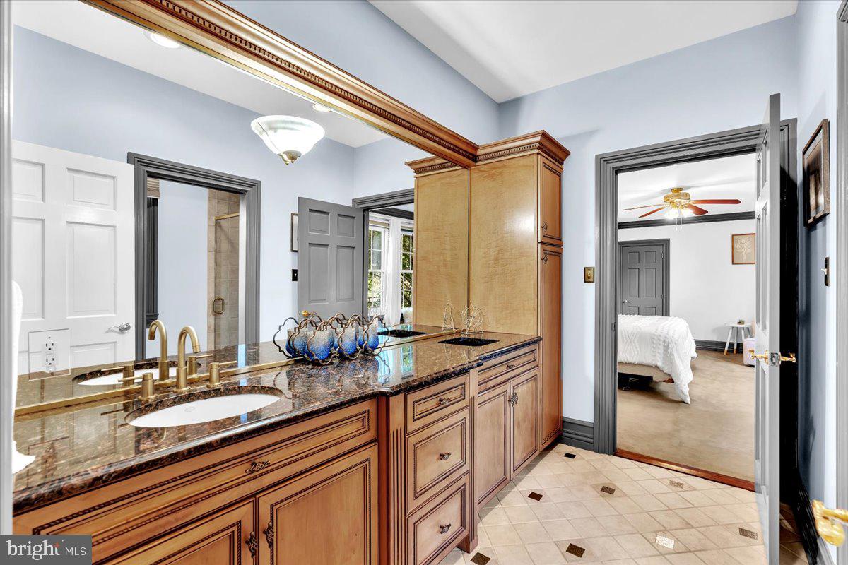 341 Station Avenue Haddonfield, NJ 08033 - Photo 30 of 71 a spacious en suite bathroom with sink and mirror