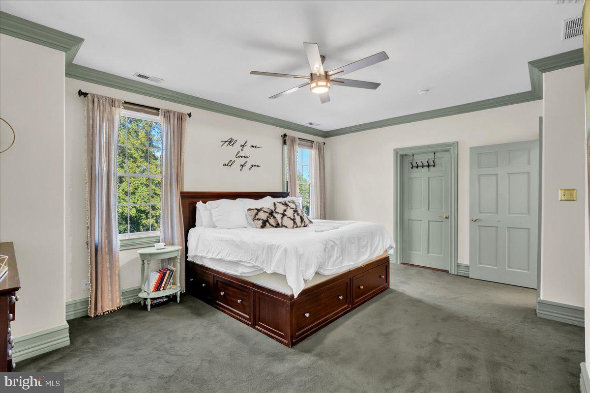 341 Station Avenue Haddonfield, NJ 08033 - Photo 35 of 71 a spacious bedroom with a bed and a window