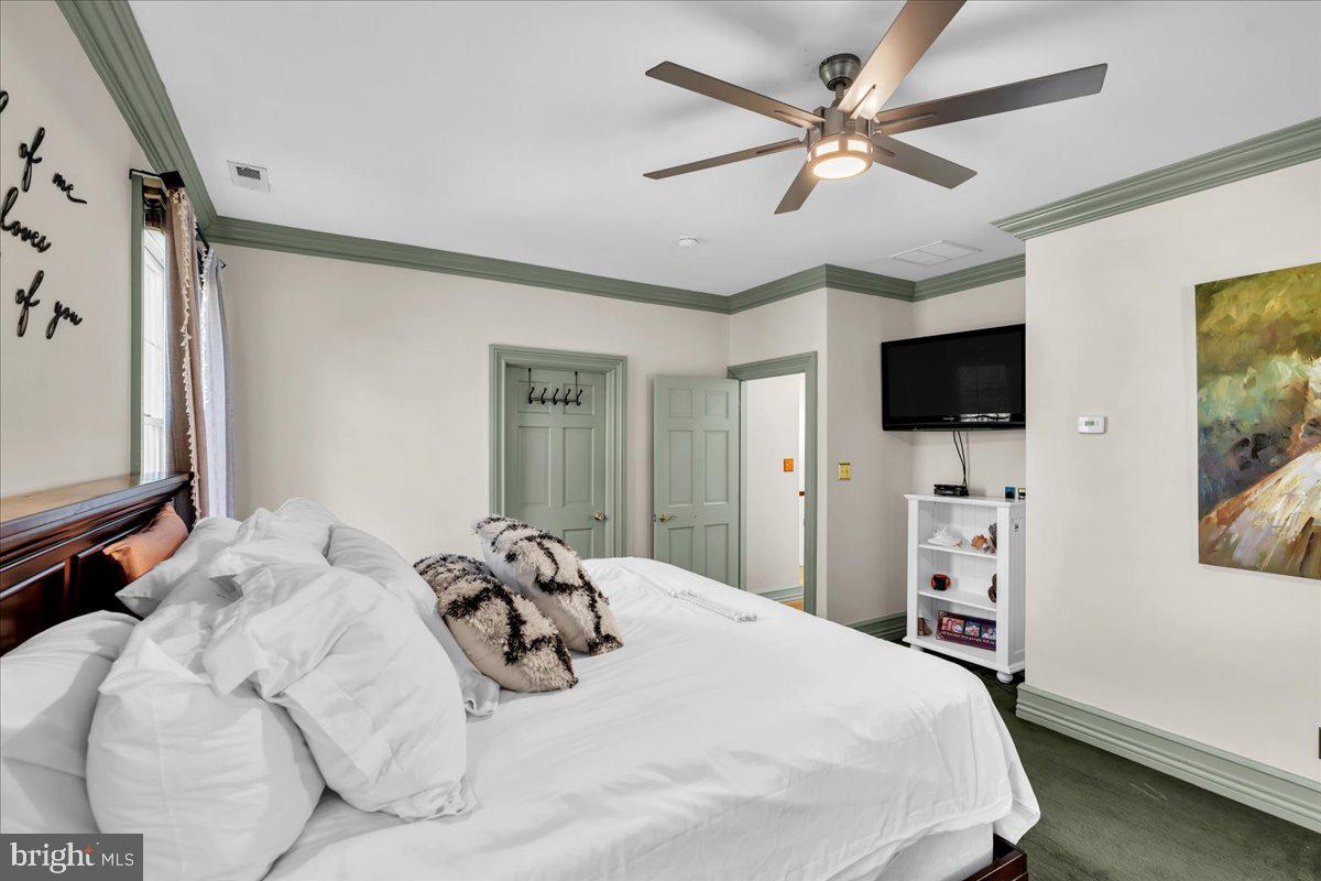 341 Station Avenue Haddonfield, NJ 08033 - Photo 36 of 71 a bedroom with a bed and a flat tv screen on dresser