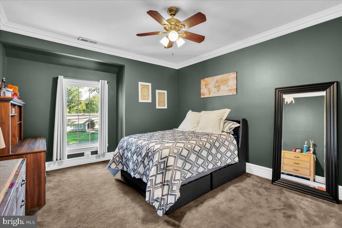 341 Station Avenue Haddonfield, NJ 08033 - Photo 41 of 71 a bedroom with a bed and a flat screen tv