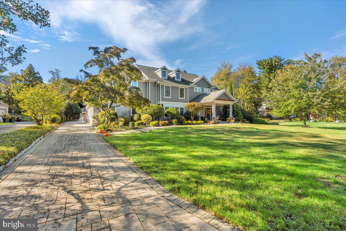 341 Station Avenue Haddonfield, NJ 08033 - Photo 5 of 71 a front view of a house with a yard