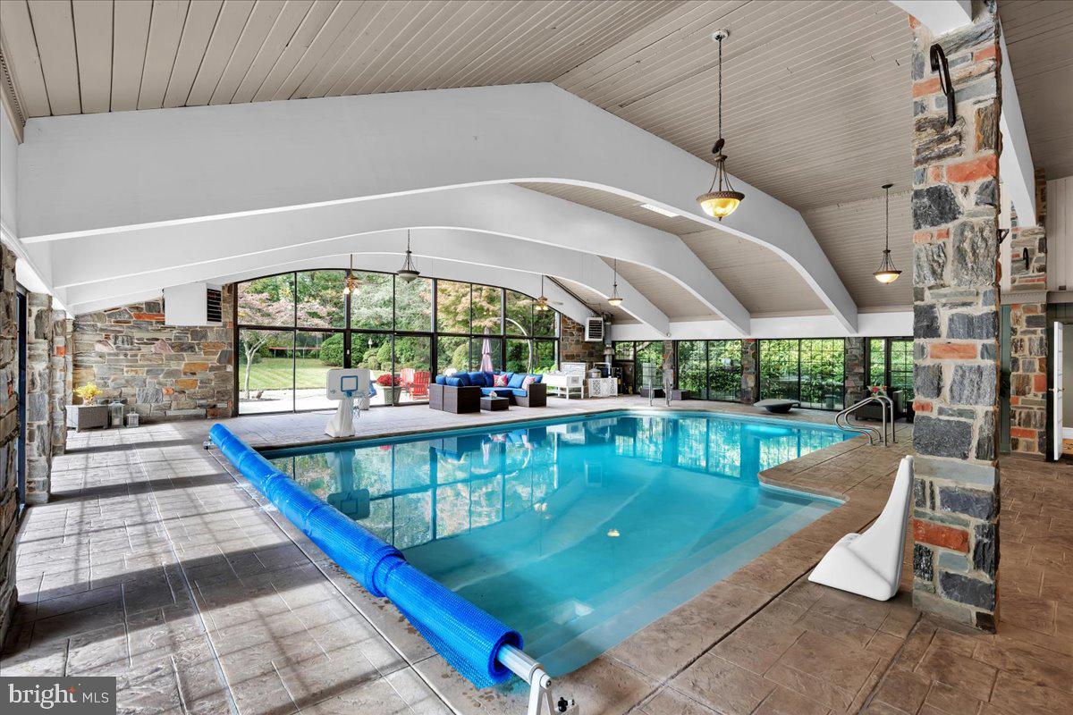 341 Station Avenue Haddonfield, NJ 08033 - Photo 53 of 71 a view of a swimming pool with a couches in a patio