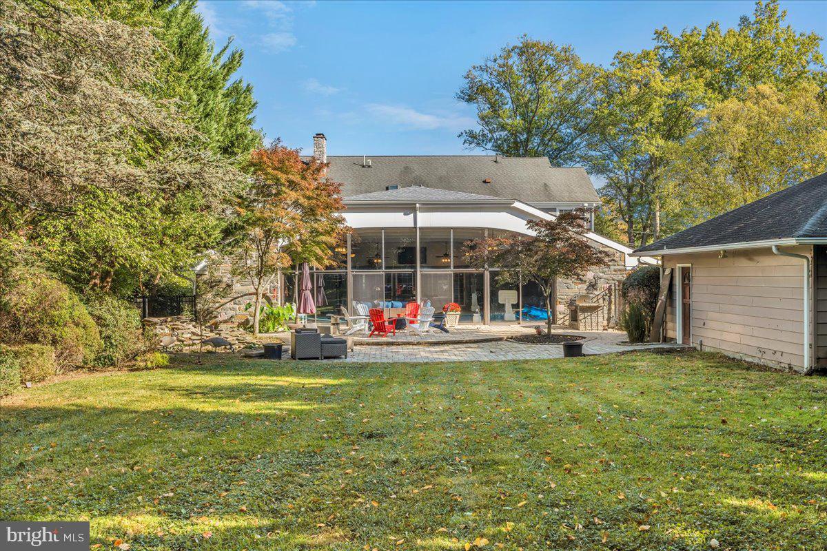 341 Station Avenue Haddonfield, NJ 08033 - Photo 59 of 71 a view of a swimming pool with lawn chairs and a big yard