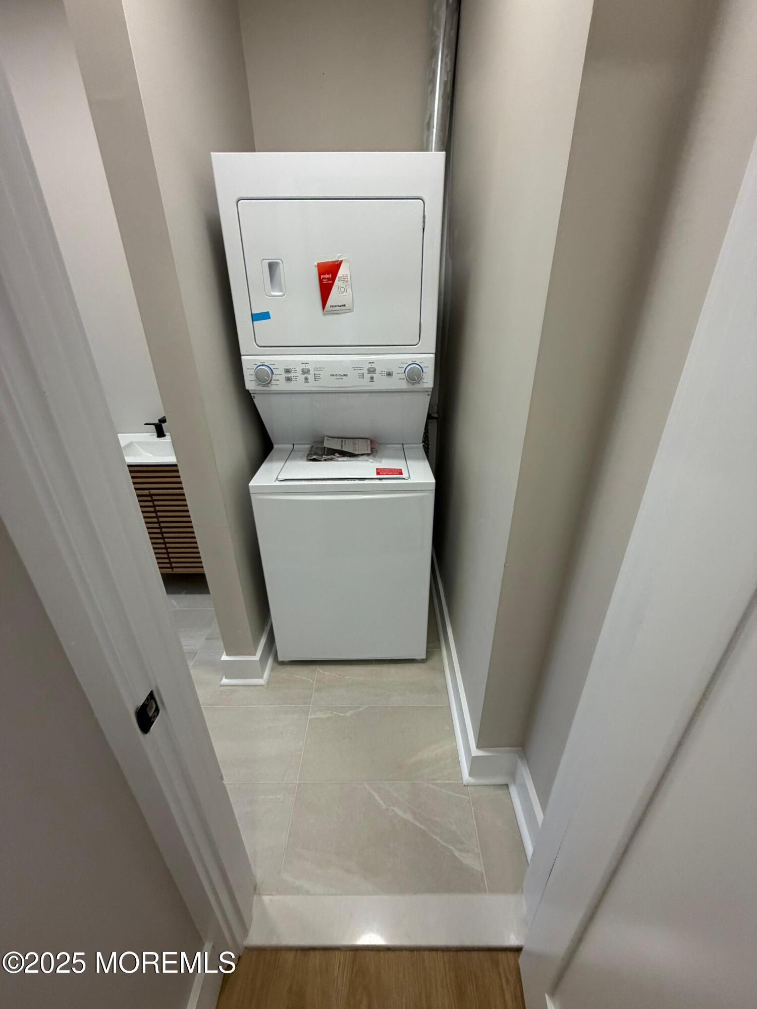 142 State Street, Unit 3 Perth Amboy, NJ 08861 - Photo 5 of 6 a utility room with dryer and washer