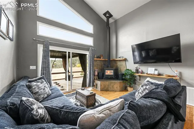 a living room with furniture a rug and a chandelier