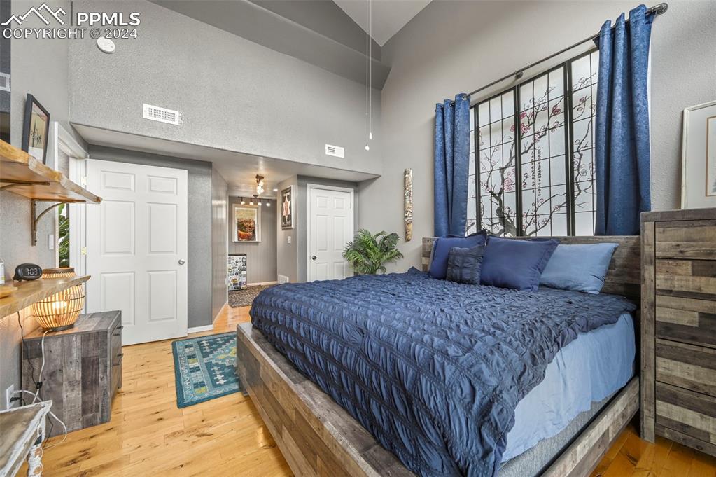 608 Slater Creek Road Guffey, CO 80820 - Photo 15 of 47 a bedroom with a large bed and a window