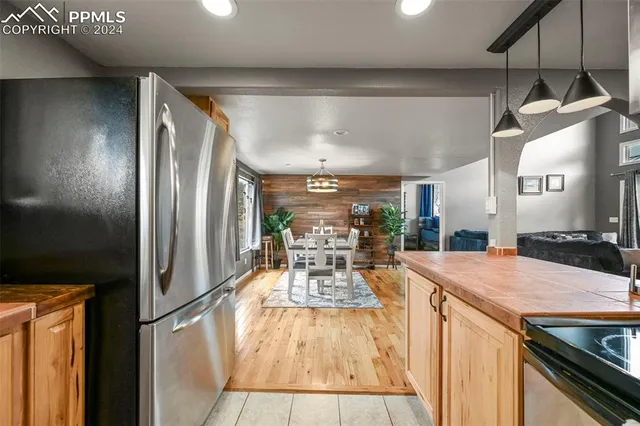 a bedroom with a bed and a lamp