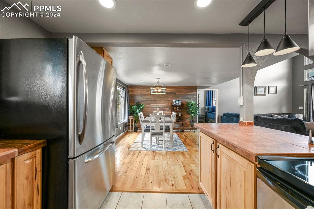 608 Slater Creek Road Guffey, CO 80820 - Photo 20 of 47 a view of a kitchen with kitchen island a counter top space a sink stainless steel appliances and cabinets