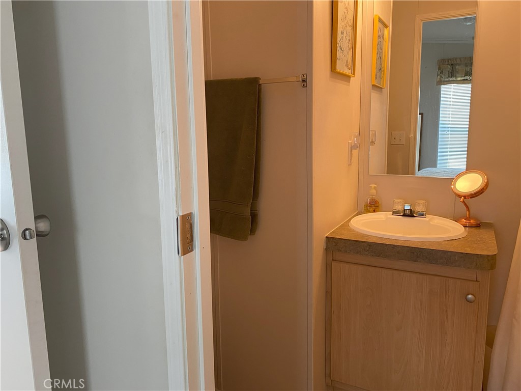 79 6th Needles, CA 92363 - Photo 15 of 15 a bathroom with a sink and mirror
