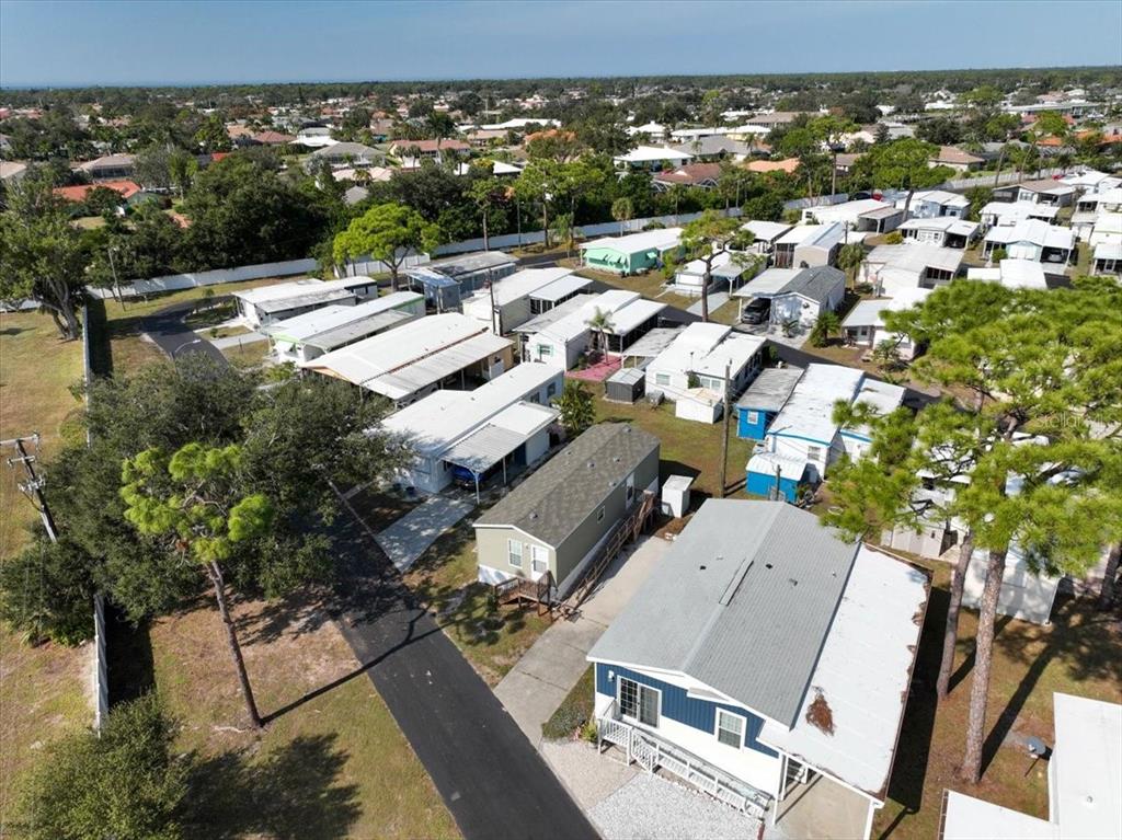 1800 Englewood Road, Unit 166 Englewood, FL 34223 - Photo 22 of 34 an aerial view of residential houses with outdoor space