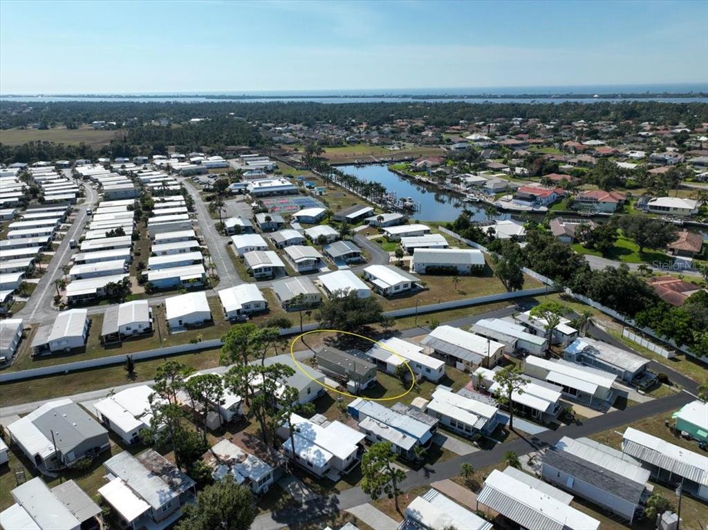 1800 Englewood Road, Unit 166 Englewood, FL 34223 - Photo 23 of 34 an aerial view of a city with lots of residential buildings