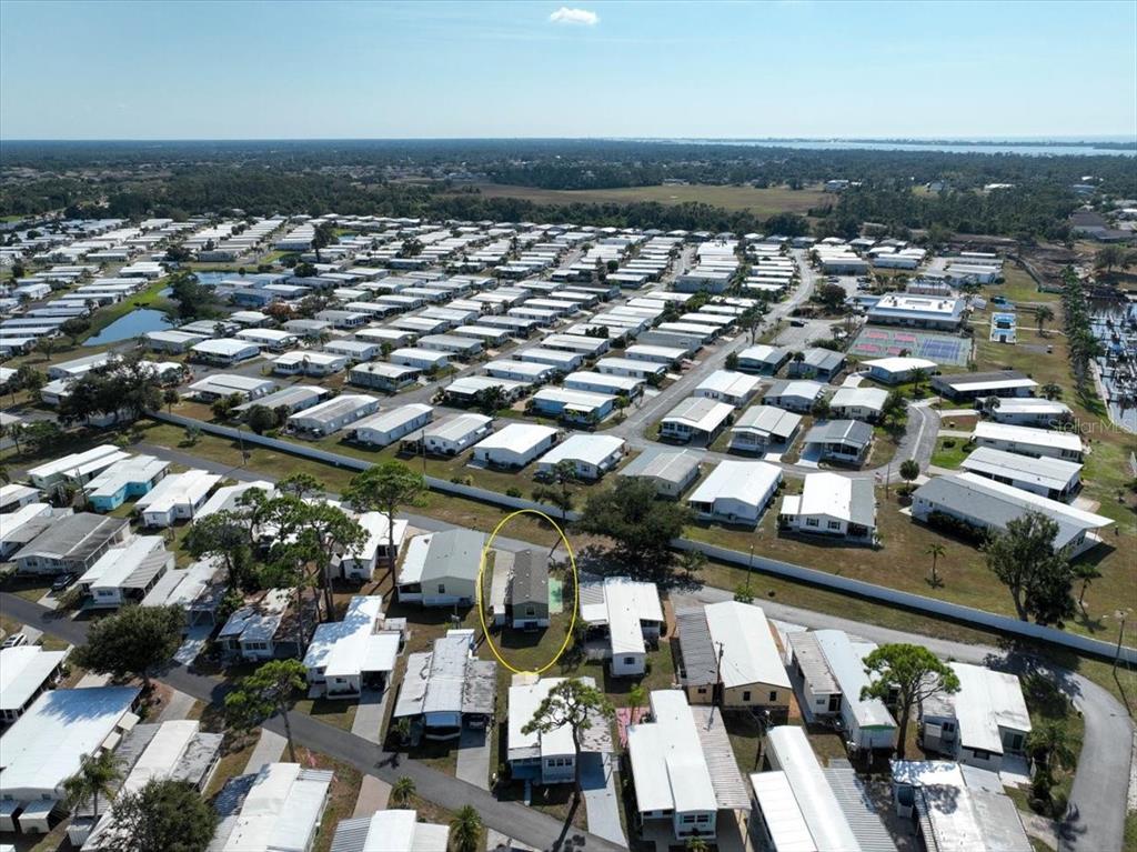 1800 Englewood Road, Unit 166 Englewood, FL 34223 - Photo 24 of 34 an aerial view of a building with parking space