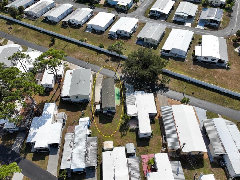 1800 Englewood Road, Unit 166 Englewood, FL 34223 - Photo 25 of 34 an aerial view of residential houses with outdoor space