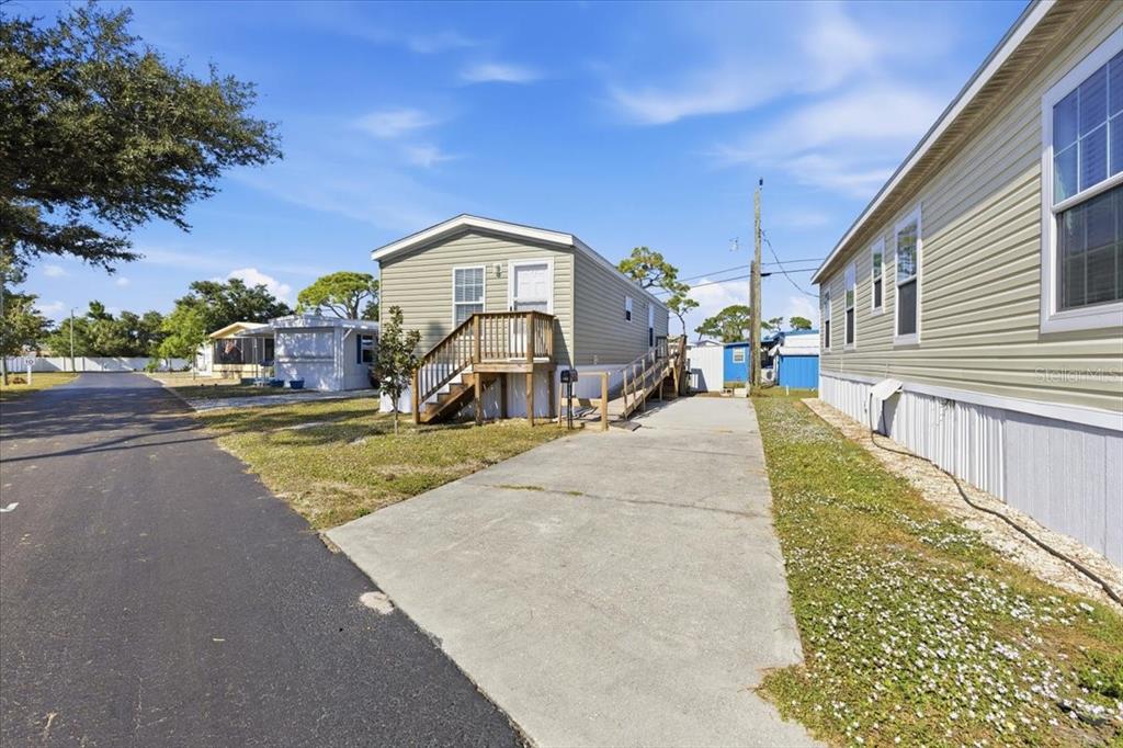 1800 Englewood Road, Unit 166 Englewood, FL 34223 - Photo 3 of 34 a view of a house with a yard