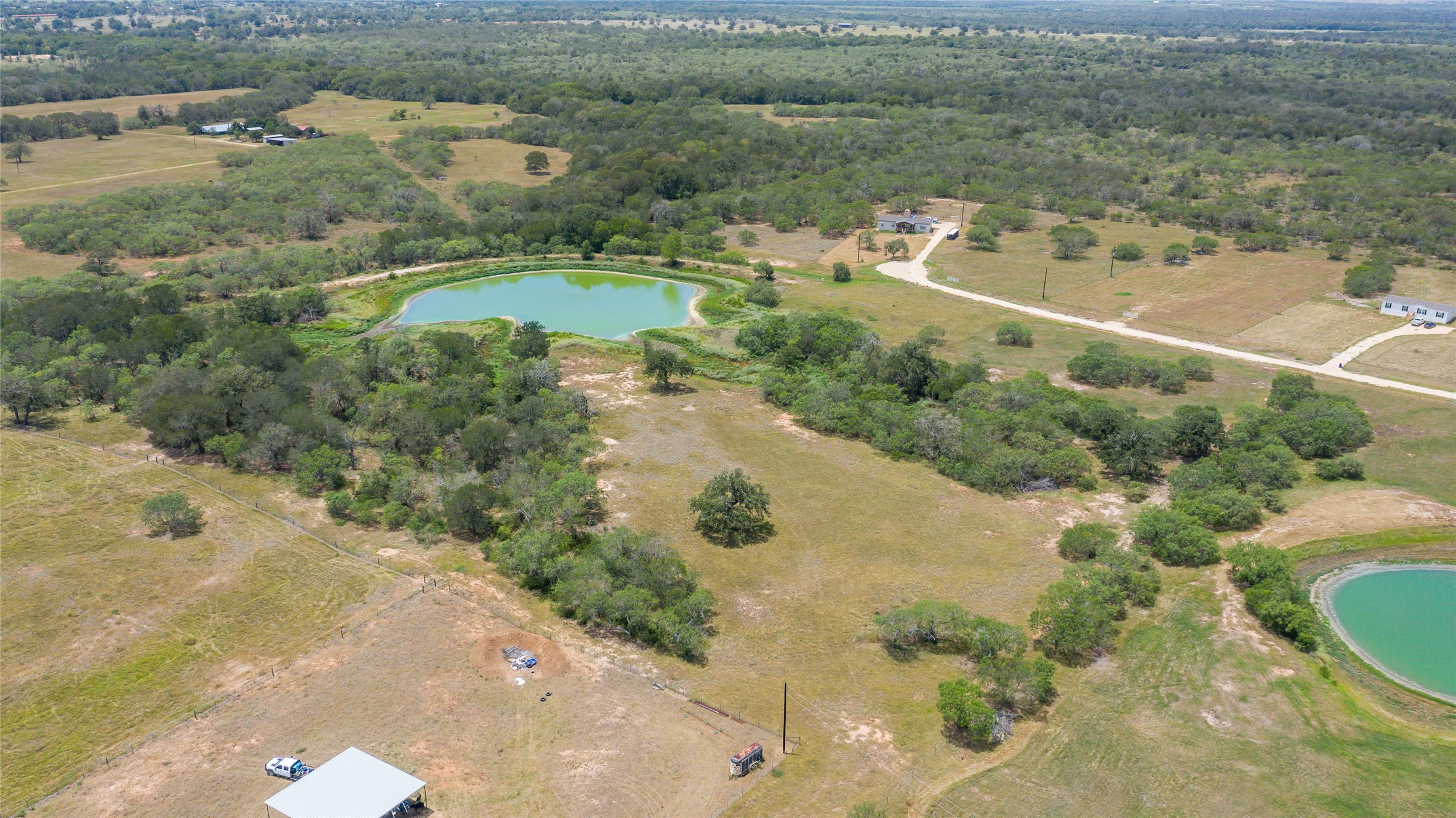 736 Cr 421 Road Waelder, TX 78959 - Photo 2 of 9 Aerial view of property's location with a nearby body of water and rural landscape