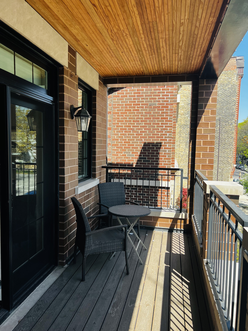 2946 North Racine Avenue, Unit 2 Chicago, IL 60657 - Photo 13 of 17 a view of a balcony with wooden floor