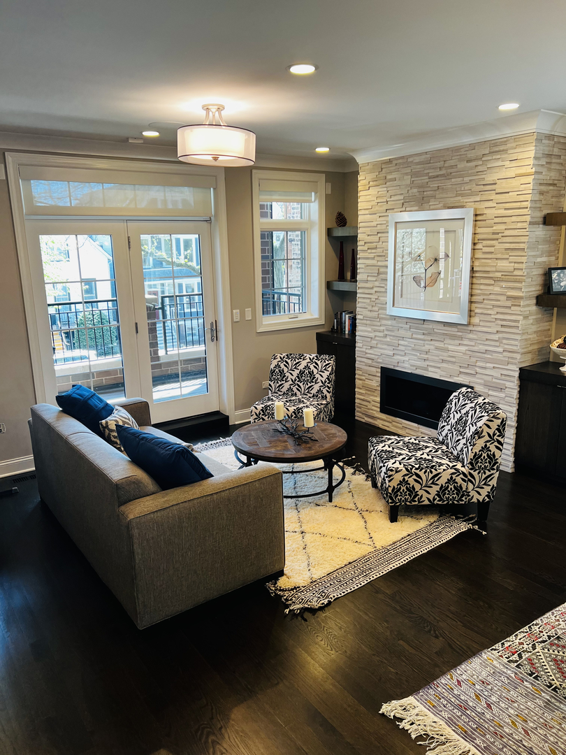 2946 North Racine Avenue, Unit 2 Chicago, IL 60657 - Photo 2 of 17 a living room with furniture fireplace and window