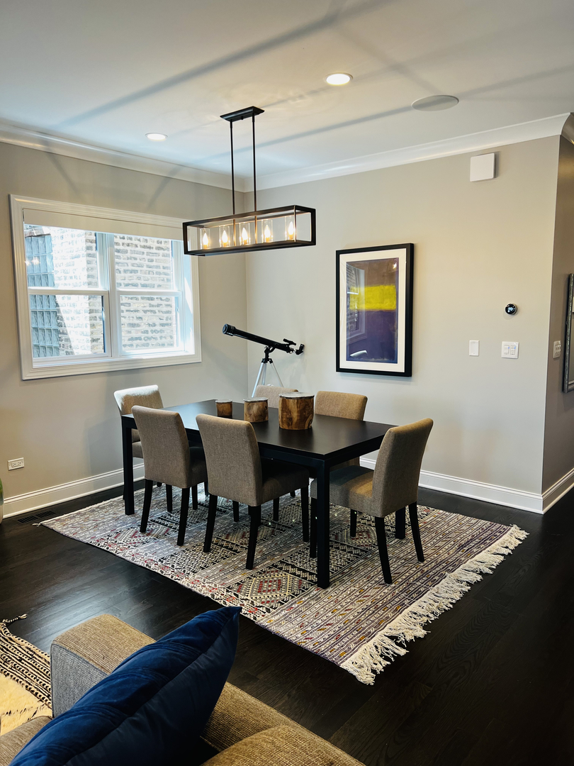 2946 North Racine Avenue, Unit 2 Chicago, IL 60657 - Photo 3 of 17 a view of a dining room with furniture