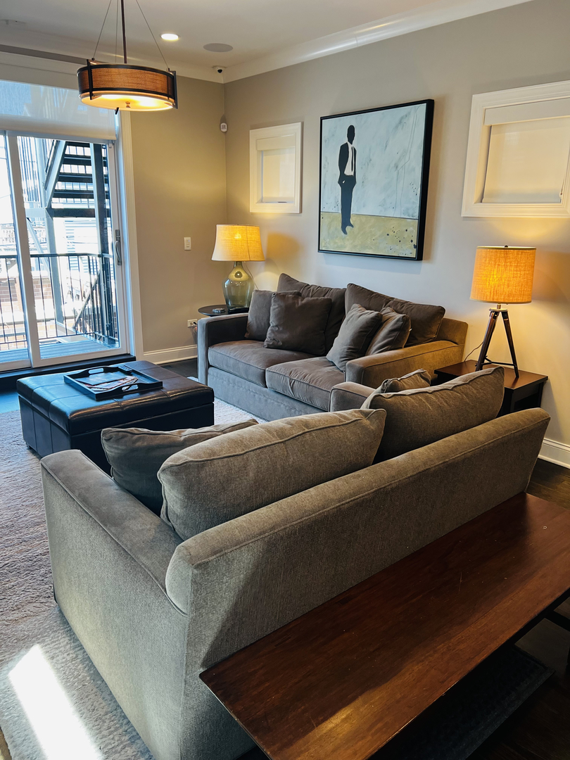 2946 North Racine Avenue, Unit 2 Chicago, IL 60657 - Photo 7 of 17 a living room with furniture and a large window