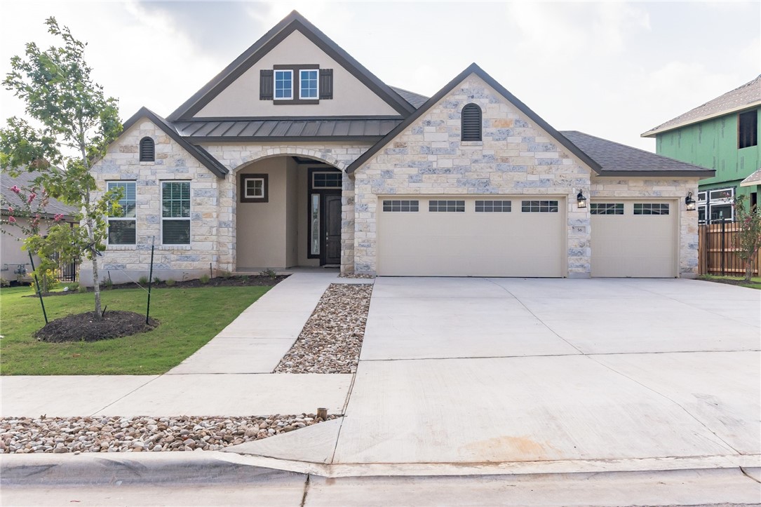 56 Rancho Trail Georgetown, TX 78628 - Photo 1 of 1 a front view of a house with a yard and garage