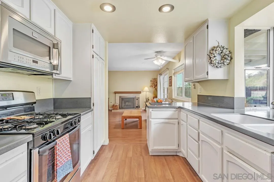 8320 Oconnell Road El Cajon, CA 92021 - Photo 15 of 62 a kitchen with stainless steel appliances a stove a sink and a refrigerator