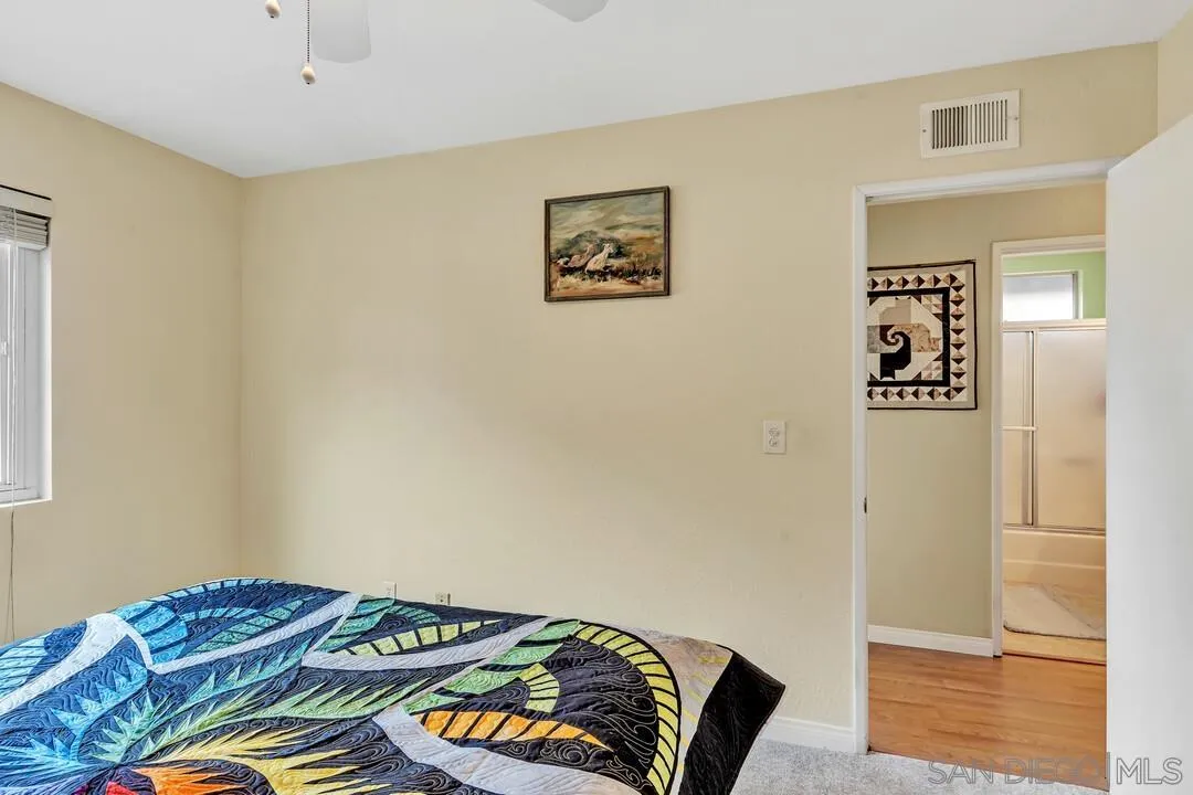 8320 Oconnell Road El Cajon, CA 92021 - Photo 30 of 62 a bedroom with a bed and a painting on the wall