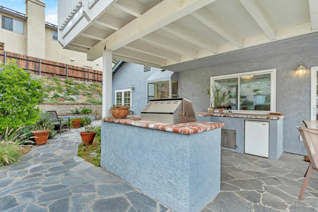 8320 Oconnell Road El Cajon, CA 92021 - Photo 37 of 62 a view of living room kitchen with stainless steel appliances granite countertop furniture and a counter top