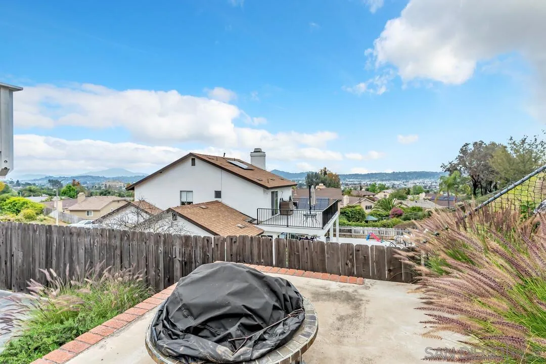8320 Oconnell Road El Cajon, CA 92021 - Photo 41 of 62 a view of a roof deck with couches and wooden fence