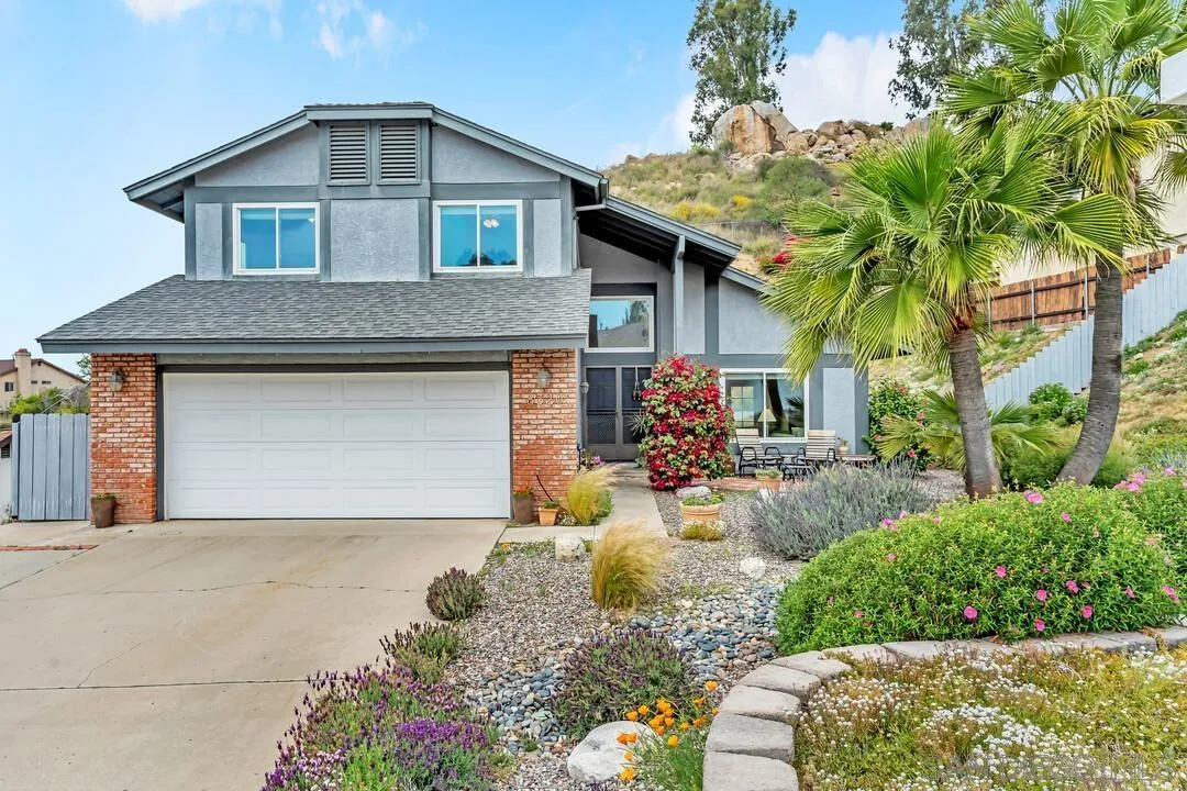 8320 Oconnell Road El Cajon, CA 92021 - Photo 61 of 62 a front view of a house with a yard garage and outdoor seating