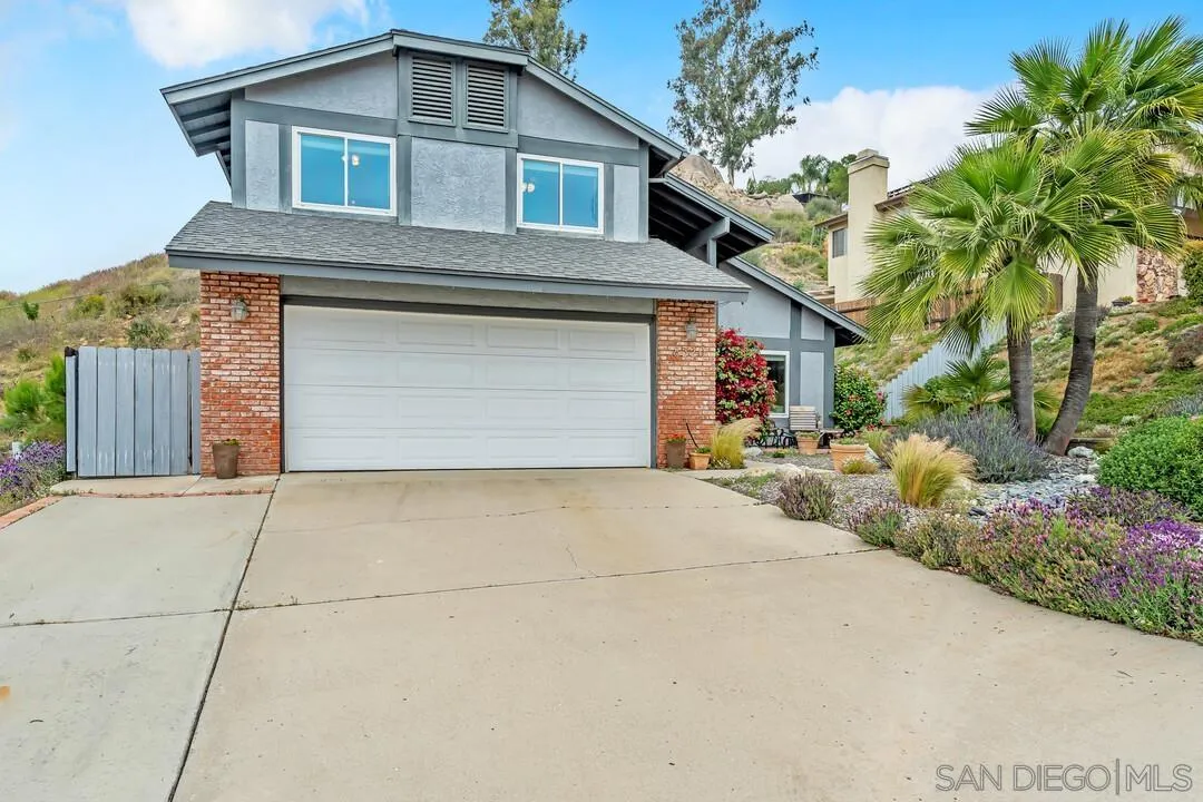 8320 Oconnell Road El Cajon, CA 92021 - Photo 62 of 62 a front view of a house with a yard and garage