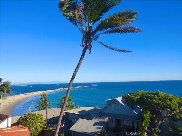a view of a terrace with couches and wooden floor