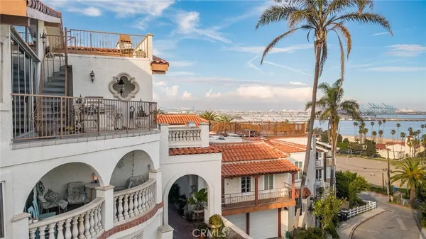 a view of a balcony with furniture and city view