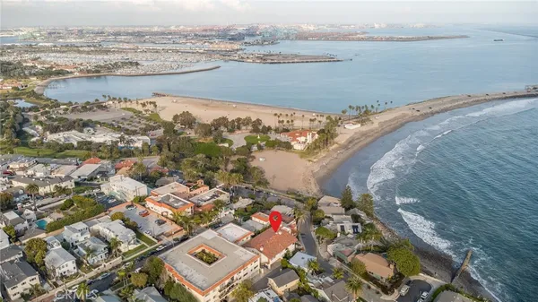 an aerial view of ocean and city