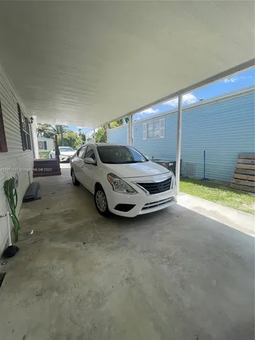 a spacious bedroom with a bed and a couch