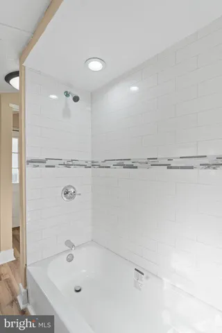 a bathroom with a shower and a sink