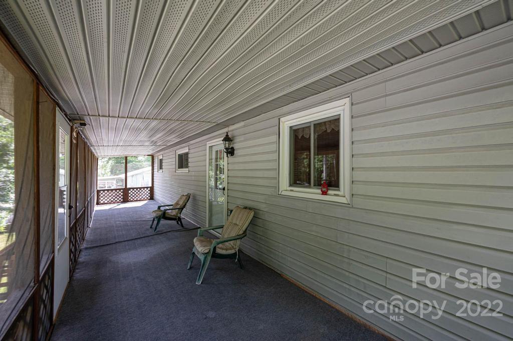 4254 Hartland Road Lenoir, NC 28645 - Photo 13 of 47 a view of a two chairs in the balcony