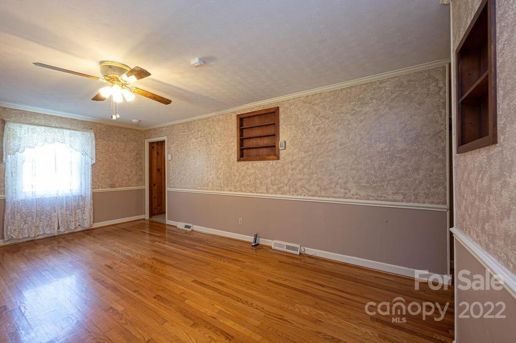 4254 Hartland Road Lenoir, NC 28645 - Photo 20 of 47 a view of an empty room with window and wooden floor