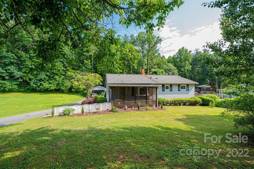 4254 Hartland Road Lenoir, NC 28645 - Photo 2 of 47 a view of a house with a yard porch and sitting area