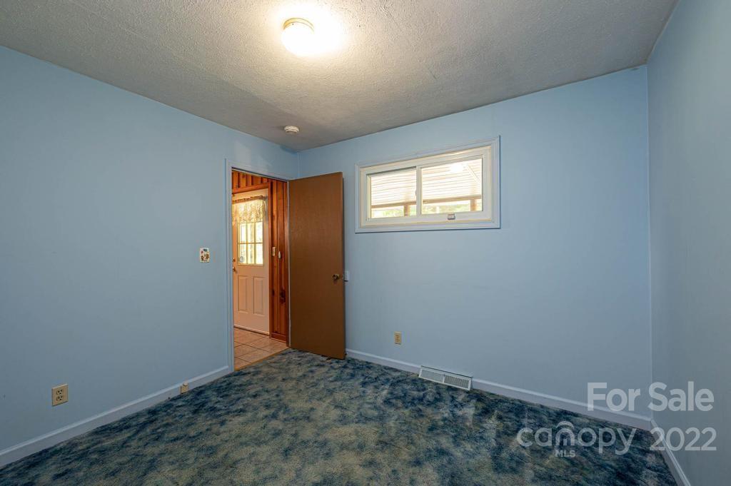 4254 Hartland Road Lenoir, NC 28645 - Photo 31 of 47 an empty room with windows