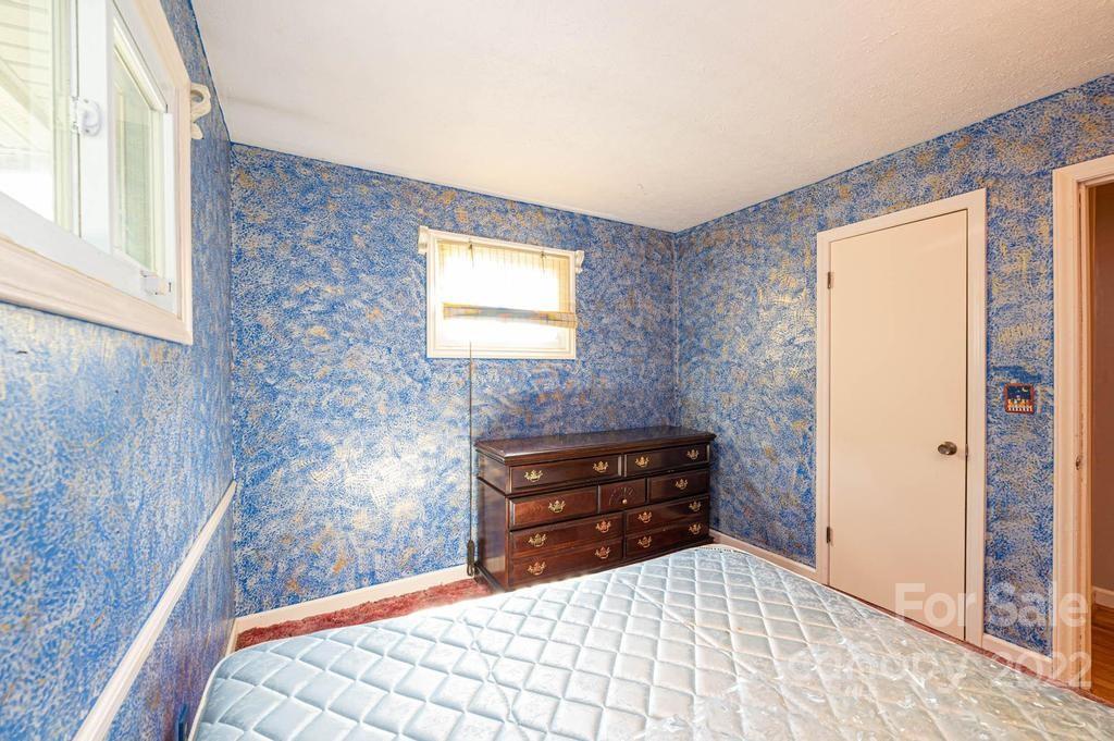 4254 Hartland Road Lenoir, NC 28645 - Photo 33 of 47 a bedroom with a bed and a dresser