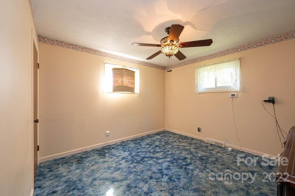 4254 Hartland Road Lenoir, NC 28645 - Photo 35 of 47 a view of a big room with carpet