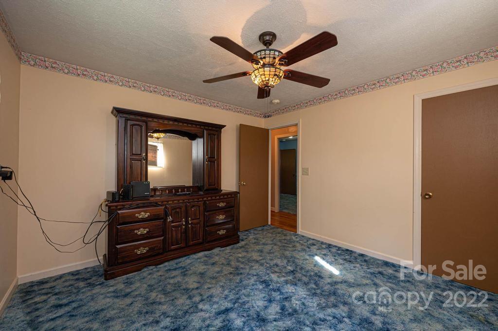 4254 Hartland Road Lenoir, NC 28645 - Photo 37 of 47 a room with a dresser and a mirror