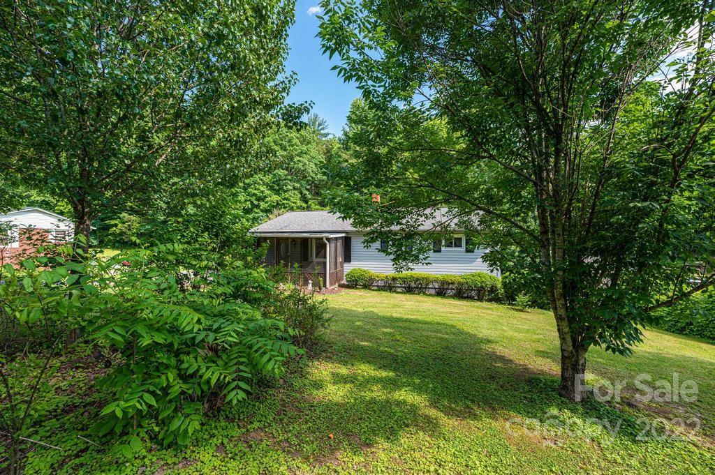 4254 Hartland Road Lenoir, NC 28645 - Photo 4 of 47 a view of a house with a yard and sitting area