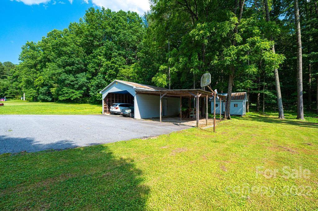 4254 Hartland Road Lenoir, NC 28645 - Photo 44 of 47 a view of a backyard with swimming pool