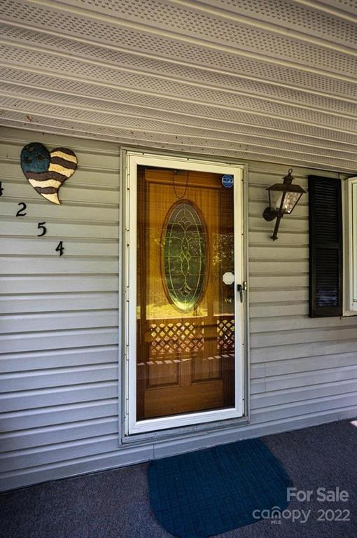 4254 Hartland Road Lenoir, NC 28645 - Photo 5 of 47 a view of front door of house