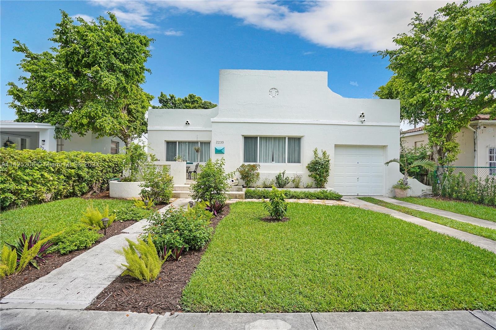 2235 Southwest 11th Terrace Miami, FL 33135 - Photo 12 of 43 a front view of house with yard and green space